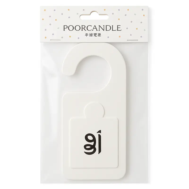 White scented door tag air freshener sealed in transparent packaging with minimalist branding